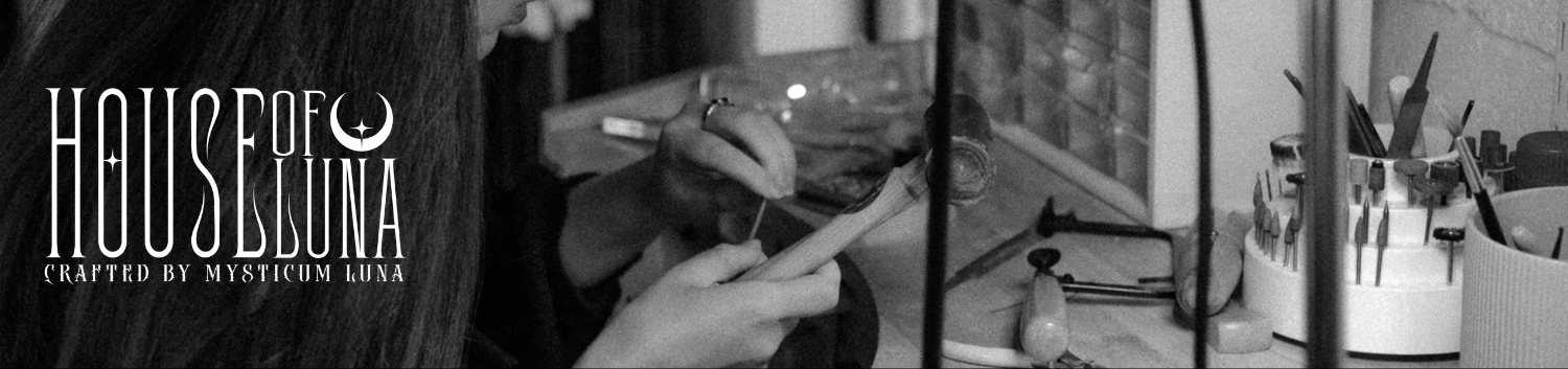 Silversmith at her jewellery bench making gothic jewellery