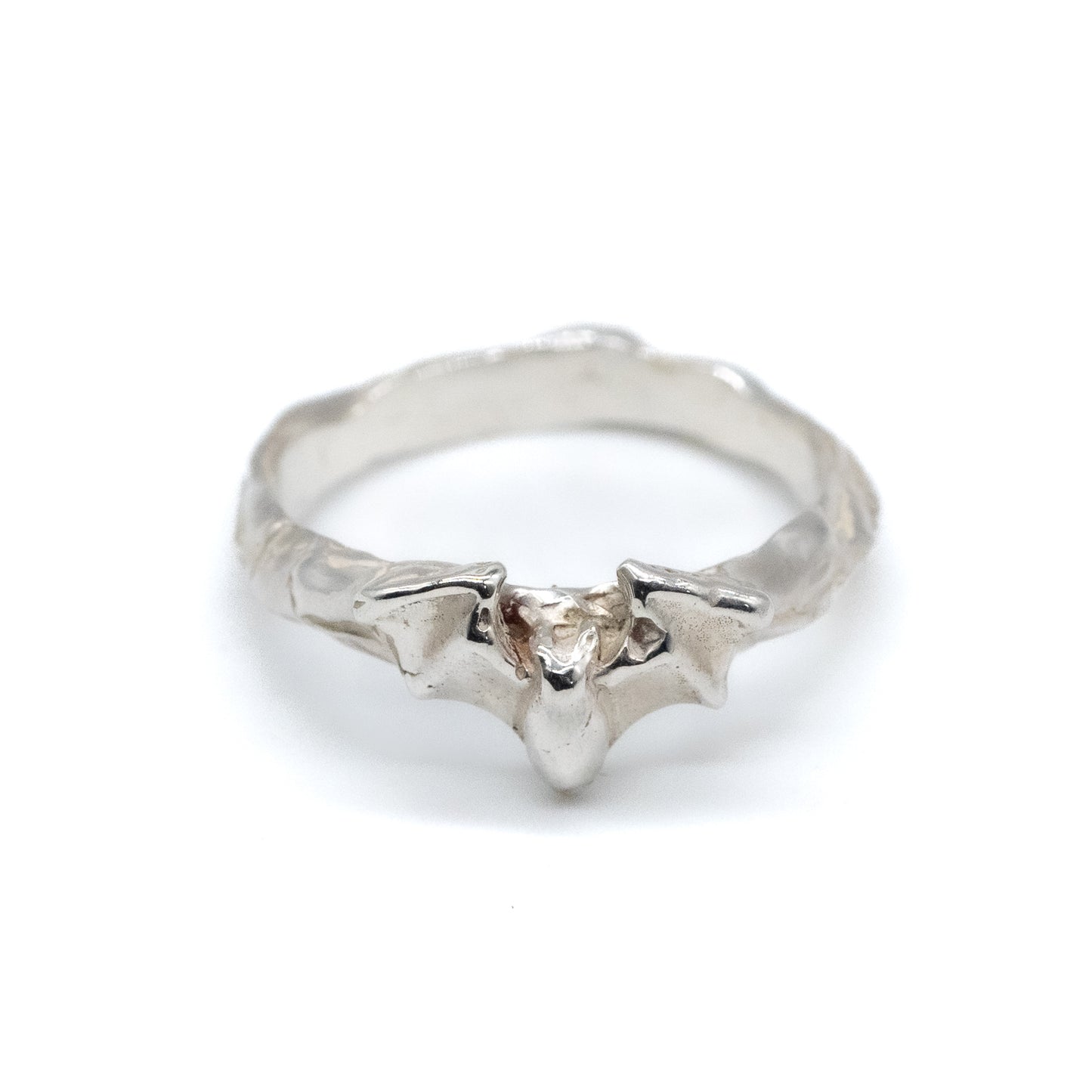 Silver ring with a bat on a white background