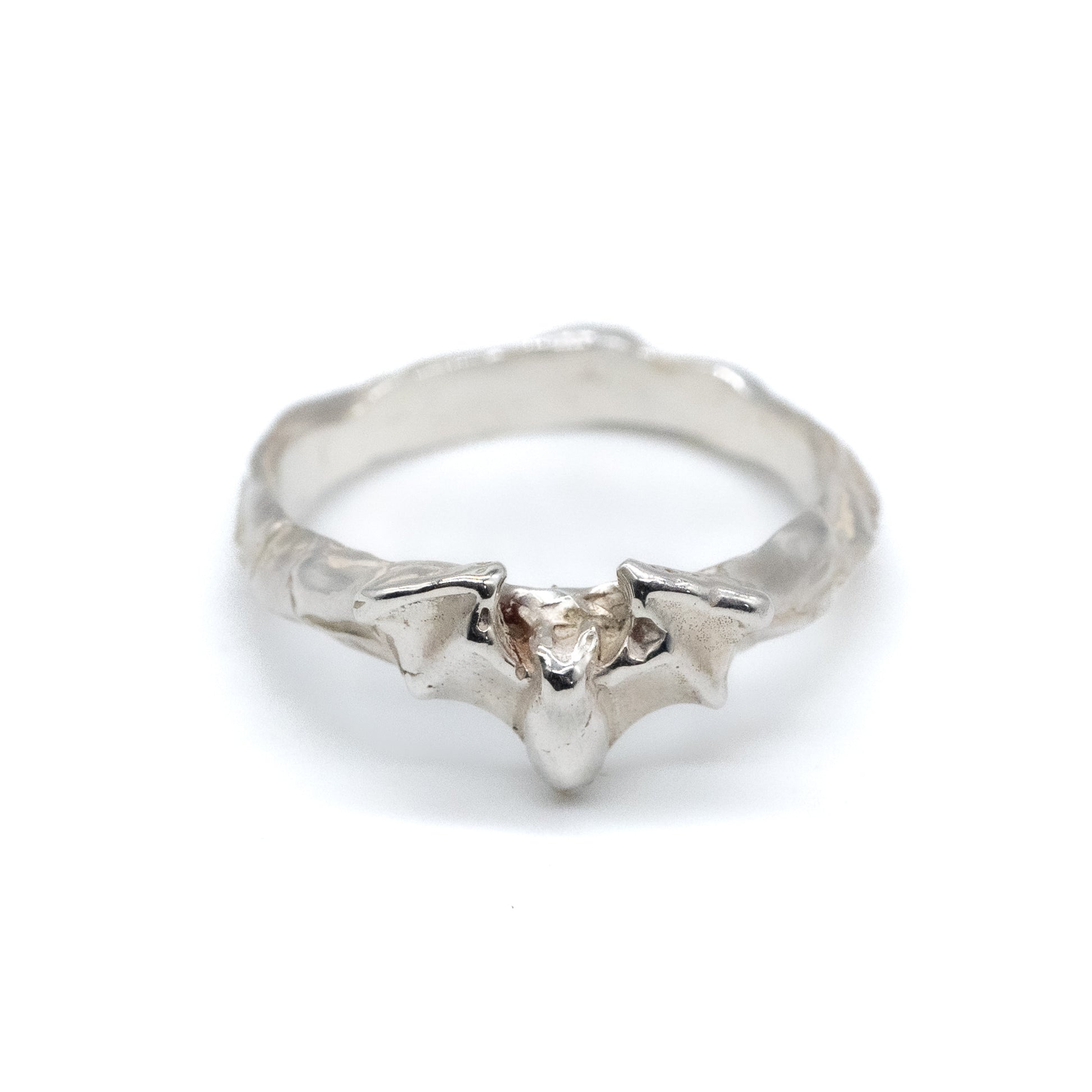 Silver ring with a bat on a white background