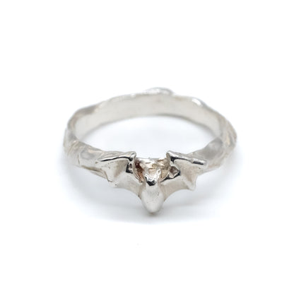 Silver ring with a bat on a white background