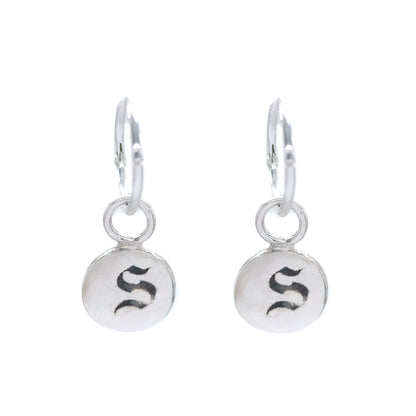 Pair of silver earrings with 'S' initials on a white background